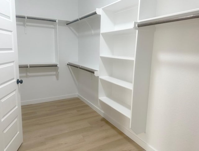 849 Cypress Ln, Cottonwood Shores, TX 78657 - walk in closet with light wood-type flooring