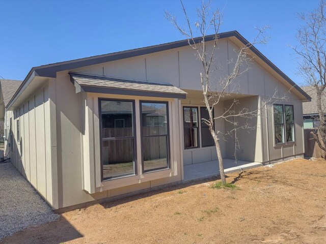 849 Cypress Ln, Cottonwood Shores, TX 78657 - rear view of property with a patio area and roof with shingles