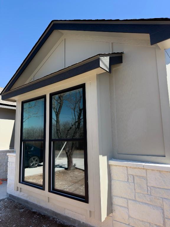 849 Cypress Ln, Cottonwood Shores, TX 78657 - view of home's exterior featuring stucco siding