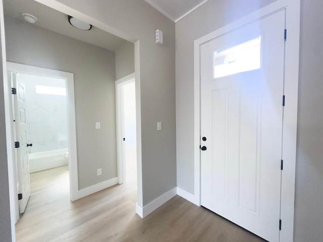 849 Cypress Ln, Cottonwood Shores, TX 78657 - foyer entrance with light wood finished floors and baseboards