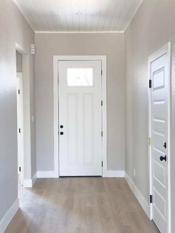 849 Cypress Ln, Cottonwood Shores, TX 78657 - foyer entrance with baseboards and light wood-type flooring