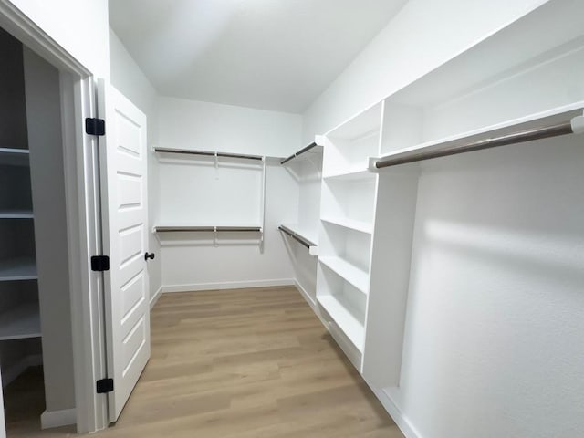 849 Cypress Ln, Cottonwood Shores, TX 78657 - walk in closet with light wood-style floors