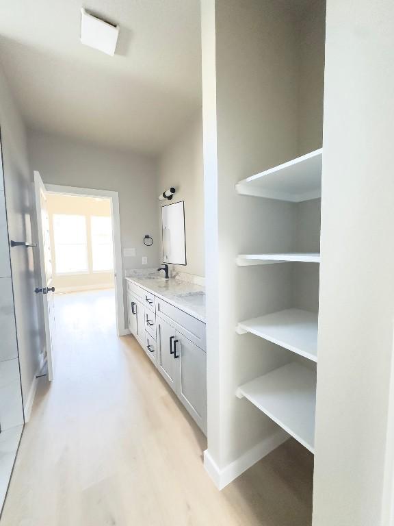 849 Cypress Ln, Cottonwood Shores, TX 78657 - hallway featuring light wood-style floors and a sink
