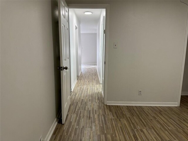 hallway with wood finished floors