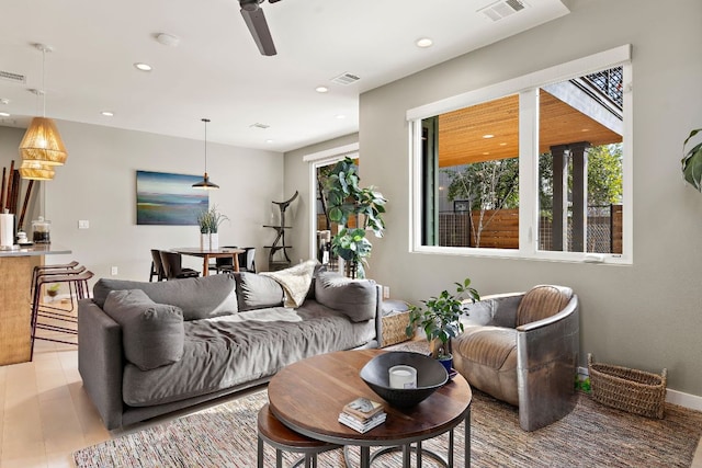 living room featuring recessed lighting, visible vents, ceiling fan, and wood finished floors