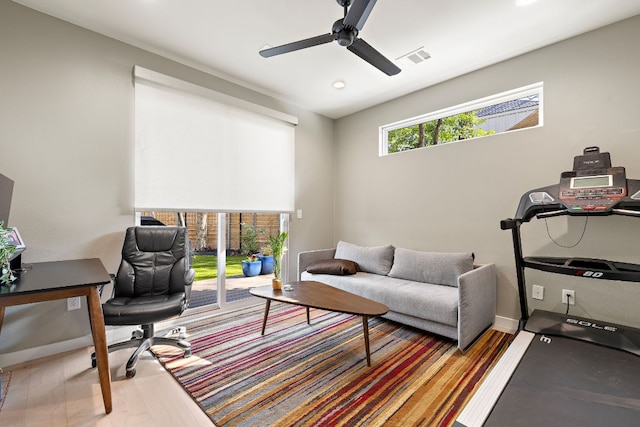 office area featuring wood finished floors, visible vents, and a ceiling fan