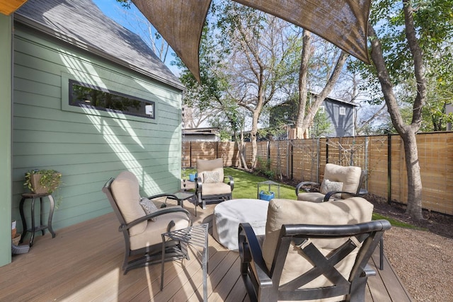 wooden deck featuring a fenced backyard and outdoor lounge area