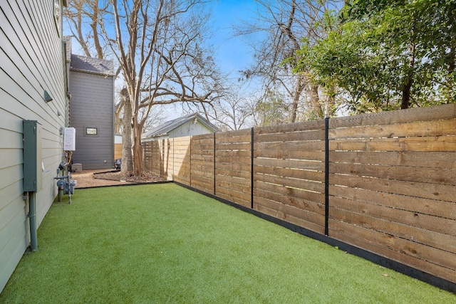 view of yard featuring a fenced backyard