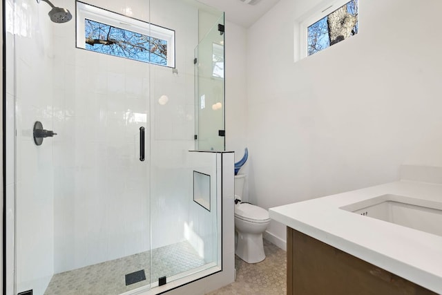 full bathroom with toilet, a stall shower, visible vents, and vanity