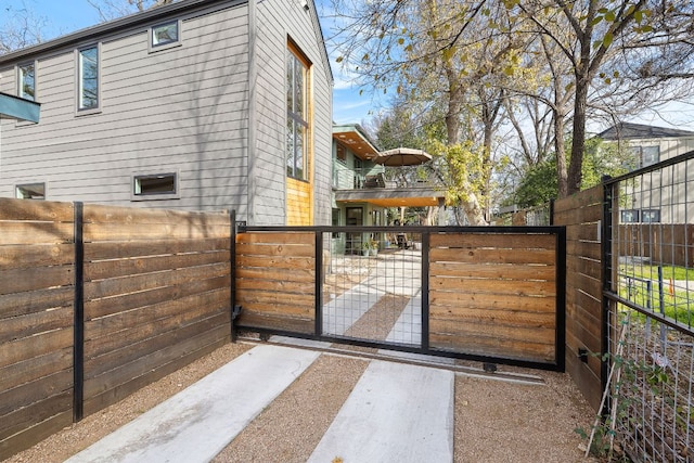 view of gate with fence