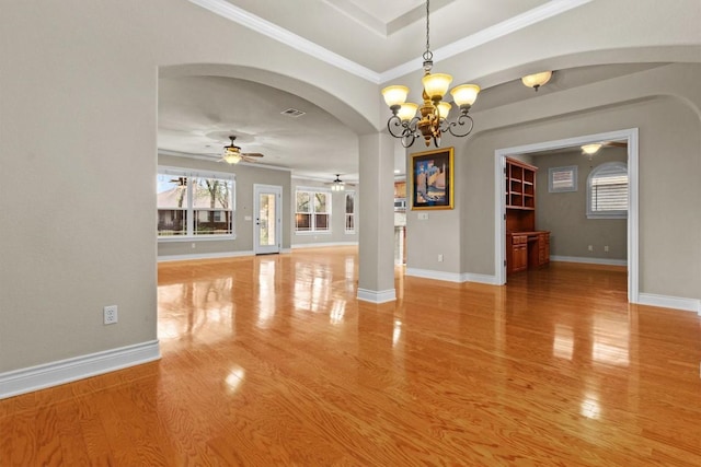 interior space featuring light wood-style flooring, baseboards, and crown molding