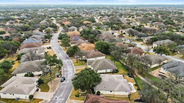 birds eye view of property with a residential view