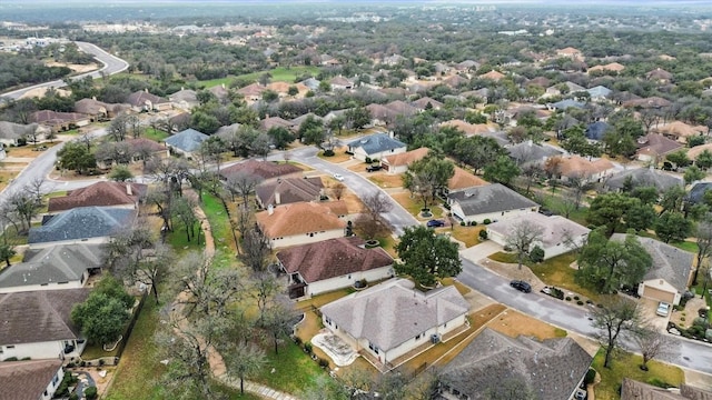 birds eye view of property with a residential view