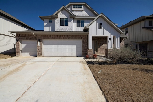 view of front facade with concrete driveway, board and batten siding, and brick siding