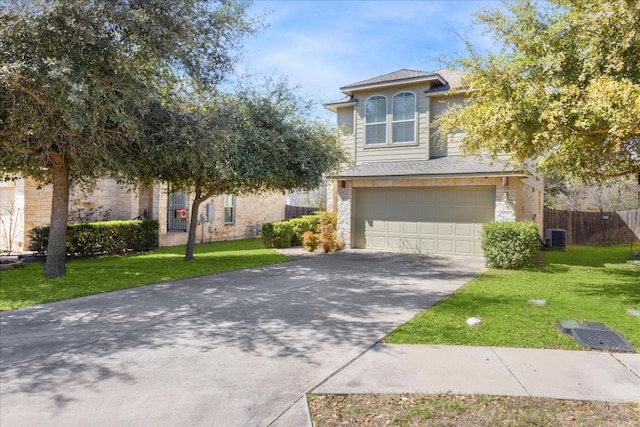 view of front of house with a front yard, fence, a garage, stone siding, and driveway