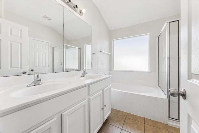 full bath featuring a bath, tile patterned flooring, a sink, and a shower stall