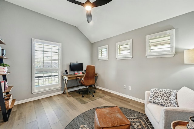 office area featuring lofted ceiling, ceiling fan, plenty of natural light, and light wood-style flooring