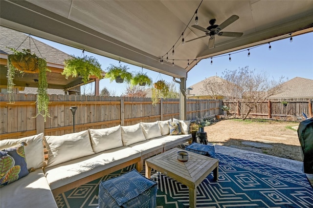 view of patio / terrace featuring a fenced backyard, ceiling fan, and an outdoor hangout area