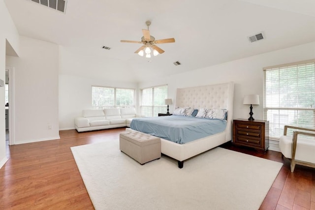 bedroom featuring multiple windows, wood finished floors, and visible vents