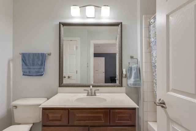 full bathroom with toilet, vanity, and a shower with shower curtain