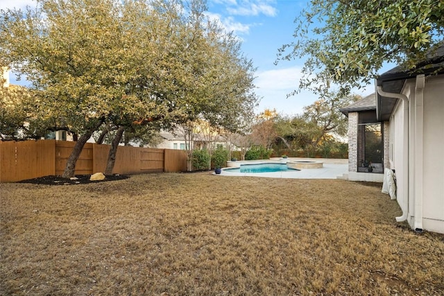 view of yard with a patio area, a fenced backyard, and a fenced in pool