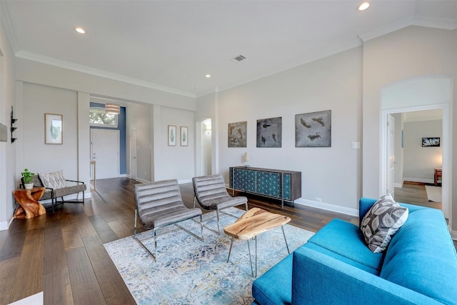 living area with dark wood finished floors and crown molding