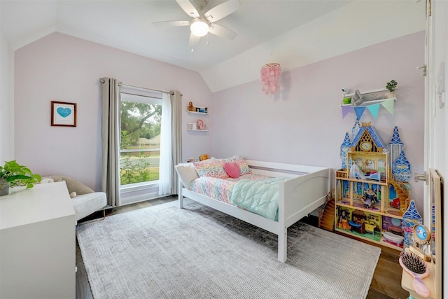 bedroom with lofted ceiling, wood finished floors, and a ceiling fan