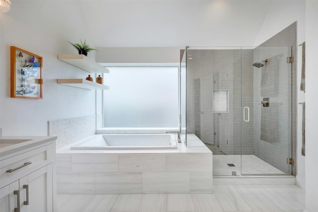 full bath featuring a shower stall, a bath, and vanity