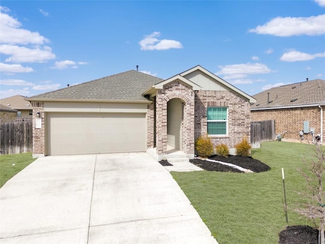 single story home featuring a garage, concrete driveway, fence, a front lawn, and brick siding