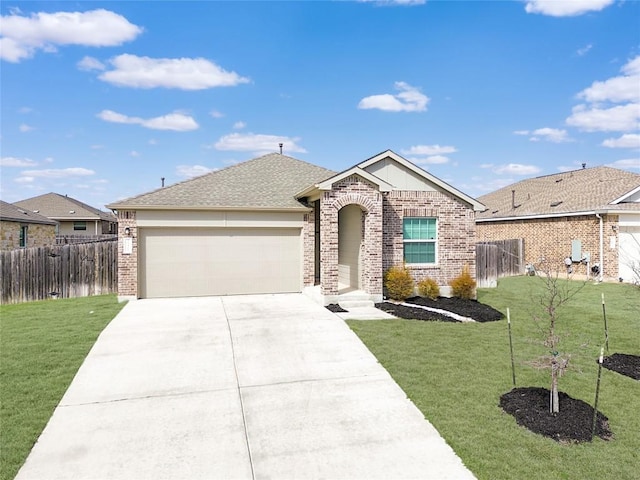 single story home featuring brick siding, fence, driveway, and an attached garage