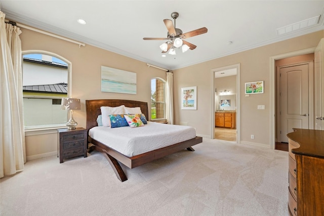 bedroom featuring ornamental molding, light colored carpet, and baseboards