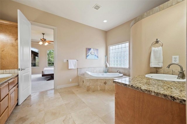 full bathroom featuring plenty of natural light, vanity, visible vents, and ensuite bathroom