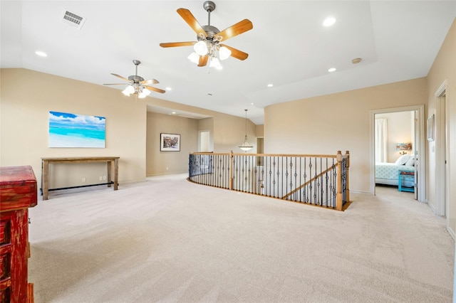 unfurnished room with vaulted ceiling, visible vents, light colored carpet, and recessed lighting