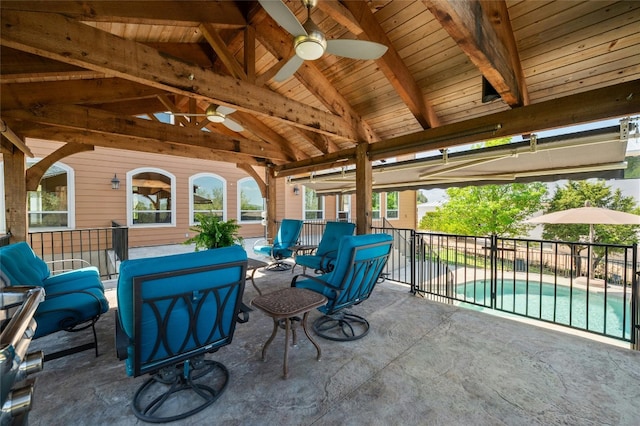 view of patio / terrace with a fenced in pool, fence, a ceiling fan, and a gazebo