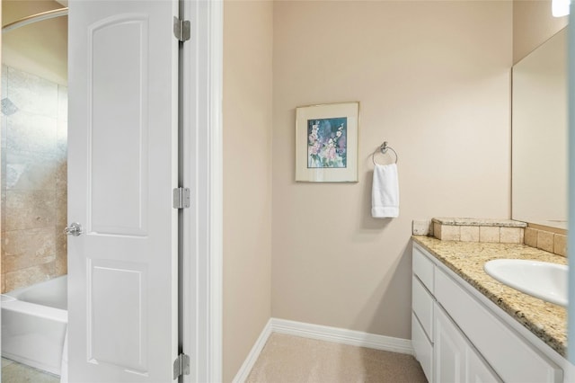 full bathroom featuring vanity and baseboards