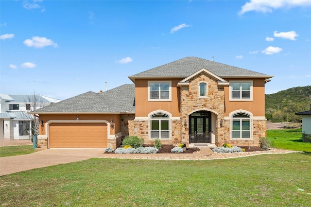 traditional-style home featuring stone siding, an attached garage, driveway, and a front lawn