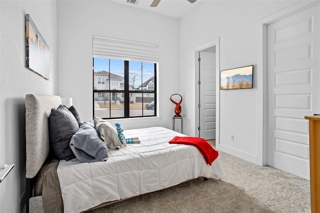 bedroom with carpet floors, baseboards, visible vents, and a ceiling fan