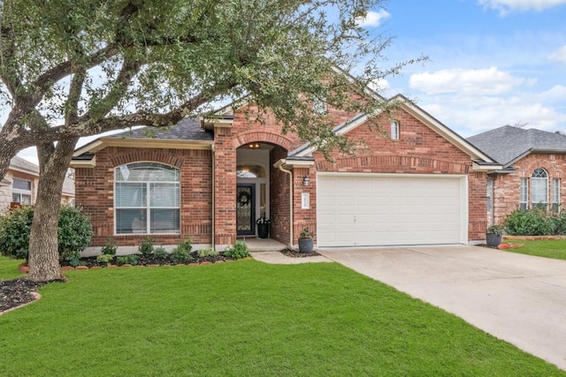 single story home with concrete driveway, brick siding, an attached garage, and a front lawn