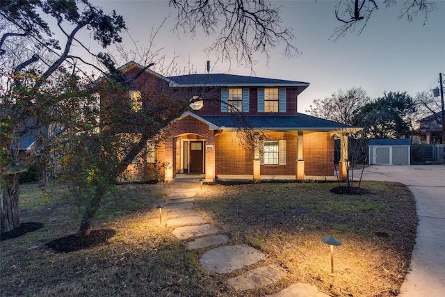 view of front of house featuring brick siding