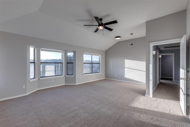 unfurnished living room with lofted ceiling, carpet flooring, visible vents, and baseboards