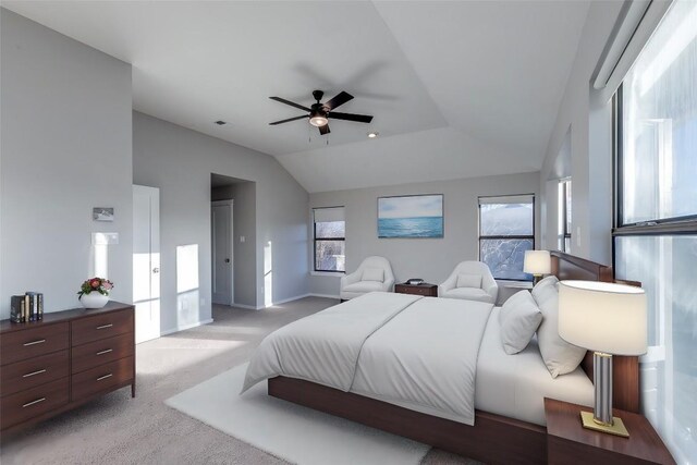 bedroom with light carpet, ceiling fan, baseboards, and lofted ceiling