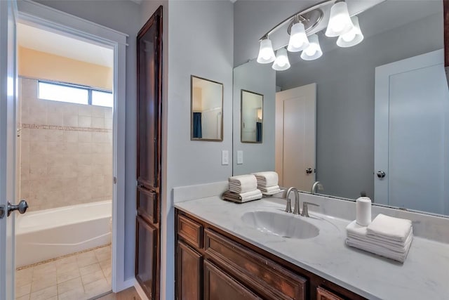 full bathroom featuring vanity, tile patterned floors, and a notable chandelier