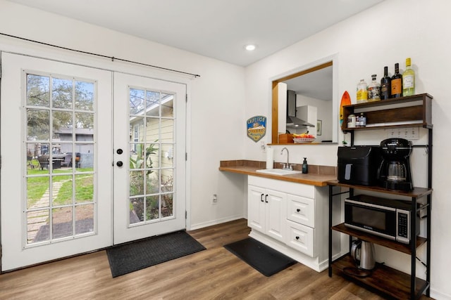 1143 Dawnridge Dr, Canyon Lake, TX 78133 - entryway featuring french doors, wood finished floors, and recessed lighting