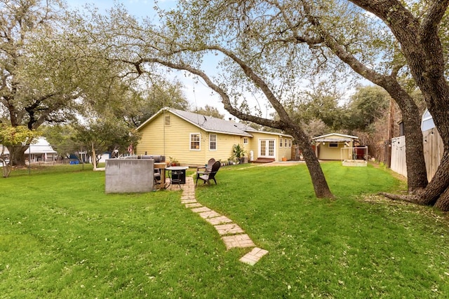 view of yard featuring entry steps and fence
