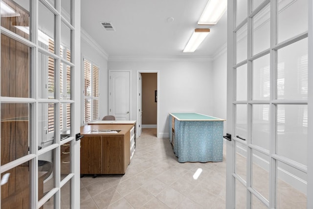 spacious closet featuring light tile patterned floors, french doors, and visible vents