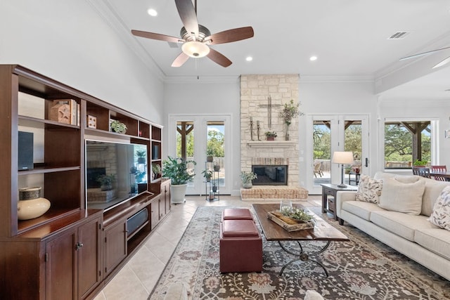 living area featuring ornamental molding, french doors, visible vents, and light tile patterned flooring