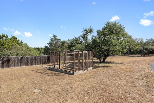 view of yard with a garden and fence