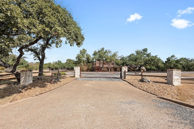 view of gate featuring fence