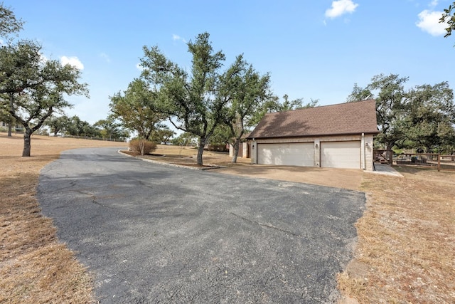 exterior space with aphalt driveway