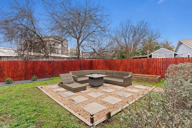 view of yard with a patio, a fenced backyard, and an outdoor living space